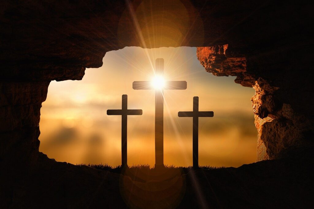 Three crosses seen through an open cave