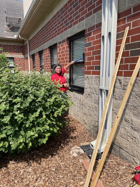 Boy Scout Parent washing windows