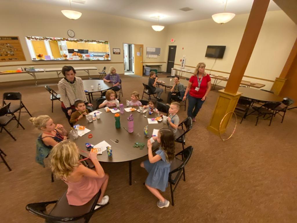 Kids enjoying craft time at a table