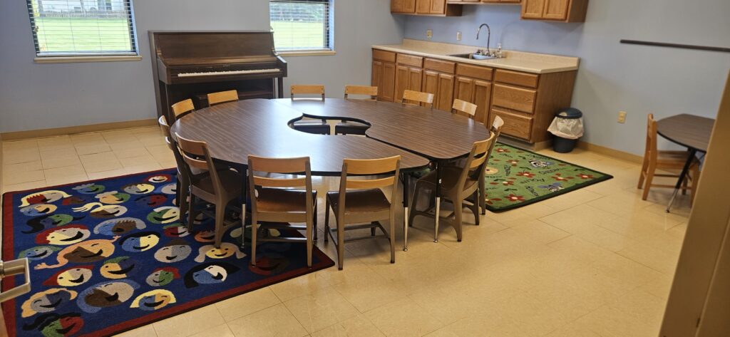 Room with small chairs and round table